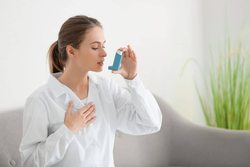 Woman with Asthma pump