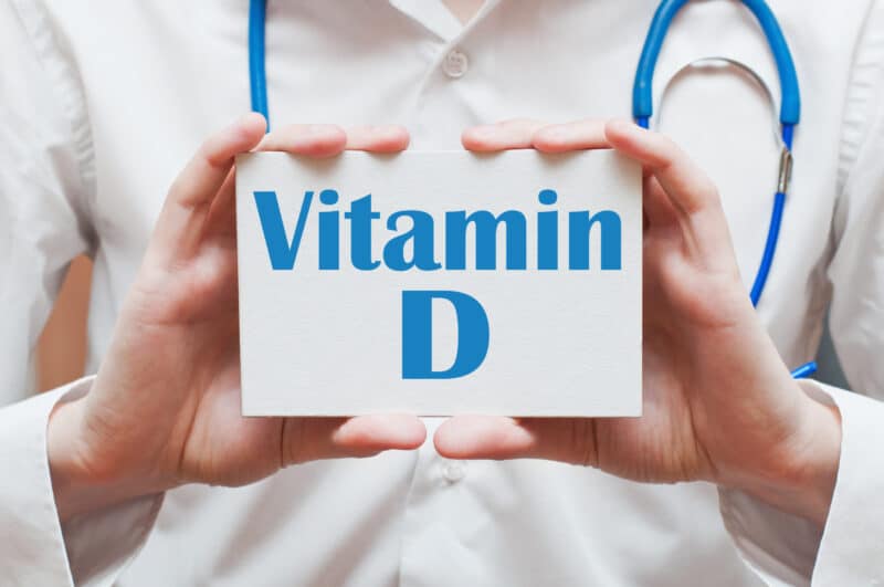 Doctor holding Vitamin D Sign