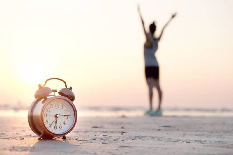 Early bird or night owl? Are you exercising at the right time of day for your sex?_Woman on Beach